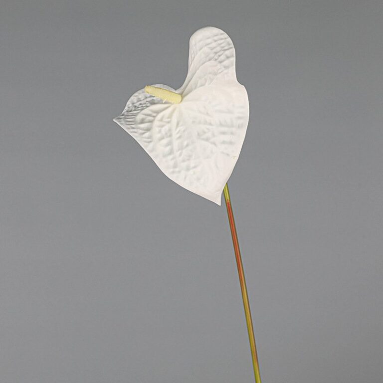 White artificial flower Anthurium silk floral decoration, realistic faux tropical bloom.