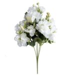 Bouquet of white artificial camellia silk flowers suitable for decoration.