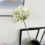 White silk Agapanthus artificial flower bouquet on a clean modern surface.