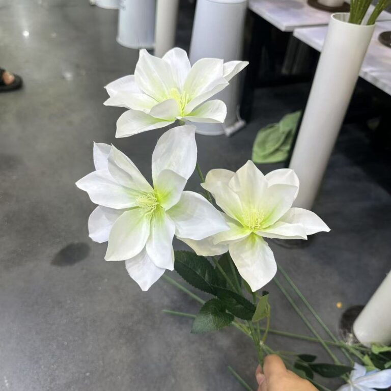 White clematis silk flower bouquet, a realistic artificial flower decoration.