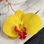 Bright yellow 3D artificial silk orchid flower head for floral decor.