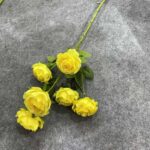 Vibrant yellow silk rose artificial flower bouquet arrangement.