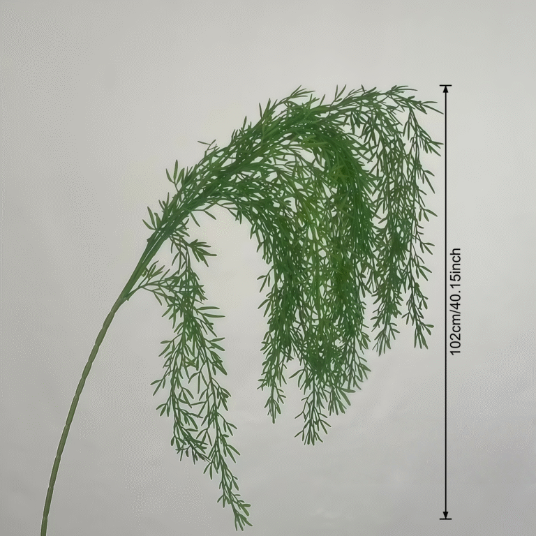 Green artificial dill branch with a ruler measuring 102cm/40.15 inches.