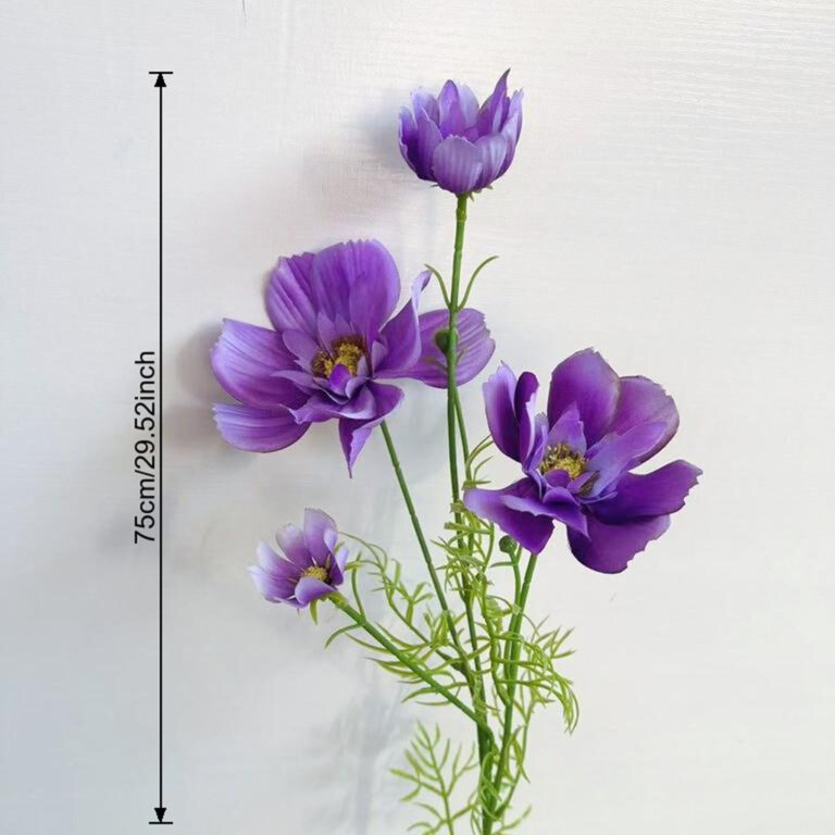 Artificial purple silk cosmos flower heads arranged on green stems for decor.