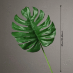 Realistic artificial flower Monstera leaf, a vibrant silk flower accent for indoor tropical decor.
