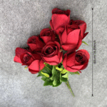 Vibrant bouquet of red silk flower roses, an elegant artificial flower arrangement.