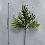 Flocked artificial acacia branches with delicate white blossoms for home decor