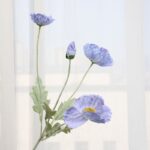 Bouquet of light blue artificial poppy flowers, perfect faux wedding flowers for decor.