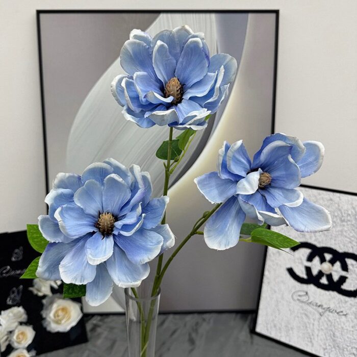 Three blue faux wedding flowers displayed, perfect artificial flower bouquet.
