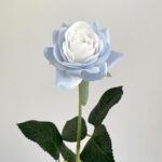 Artificial blue rose bloom with green foliage, perfect for faux wedding decor.
