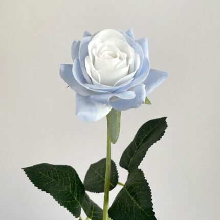 Artificial blue rose bloom with green foliage, perfect for faux wedding decor.