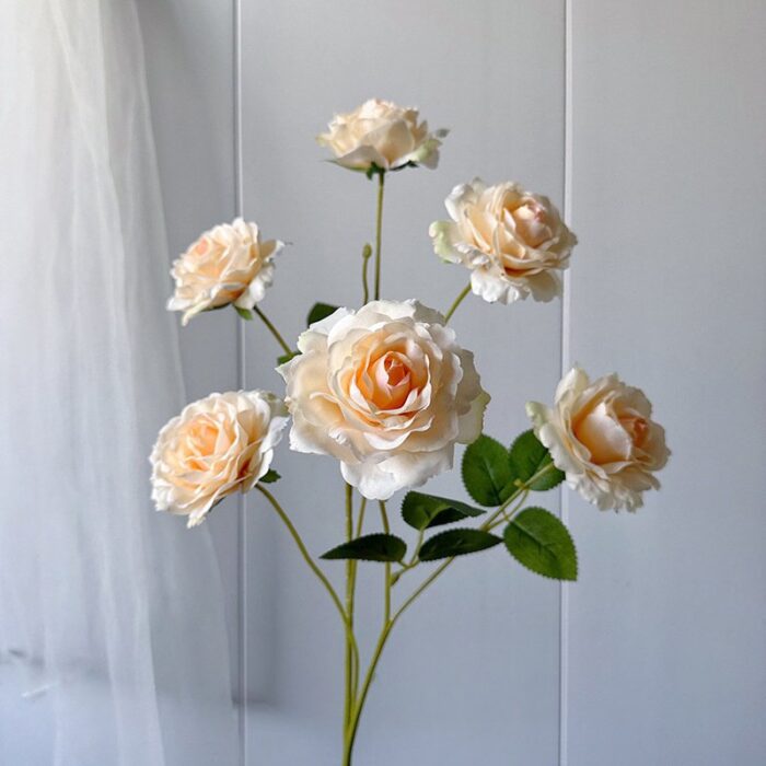 Six artificial roses perfect for wedding decor. These faux wedding flowers have a lifelike real touch.