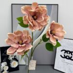 Three silk magnolia flowers, a beautiful artificial flower arrangement perfect for wedding decor.