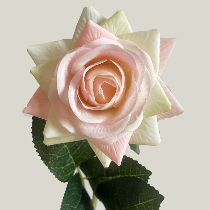 Realistic pink and cream artificial flower rose, perfect for faux wedding decor accents.