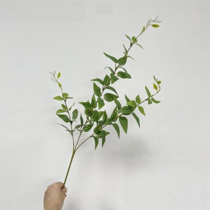 Bundle of silk green leaves for wedding decor, used as faux wedding flowers.