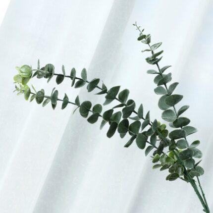 Branch of artificial eucalyptus greenery, perfect for faux wedding flowers decor.