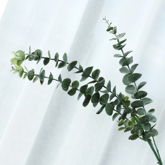 Branch of artificial eucalyptus greenery, perfect for faux wedding flowers decor.