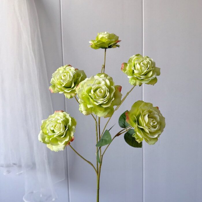 Cluster of six light green silk roses, perfect artificial flower decor for weddings.