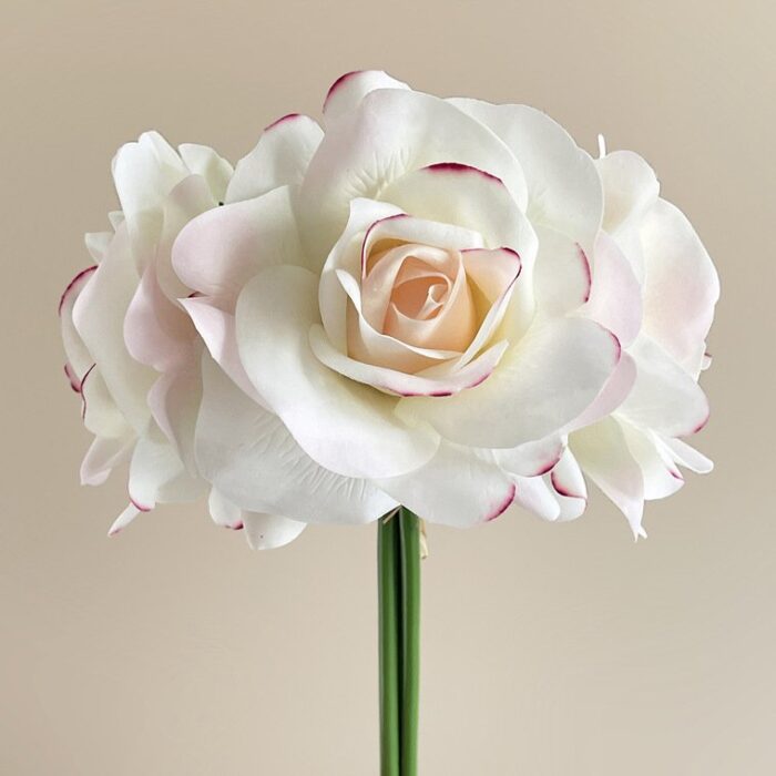 Bouquet of realistic white and blush pink artificial roses, perfect for faux wedding flowers.