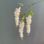 Cascading hanging faux flowers arrangement of pale pink and white blooms, perfect for wedding decor.