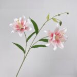 Two realistic silk lily blooms, ideal as faux wedding flowers for decor arrangements.