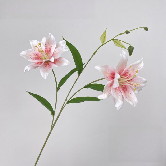 Two realistic silk lily blooms, ideal as faux wedding flowers for decor arrangements.
