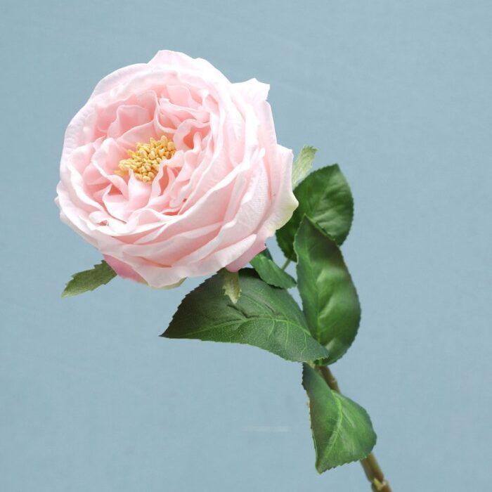 Soft pink artificial flower rose bloom for wedding decor arrangements.