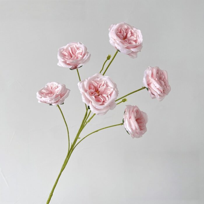 Bouquet of pink silk roses, beautiful faux wedding flowers providing a realistic real touch wedding flower accent.