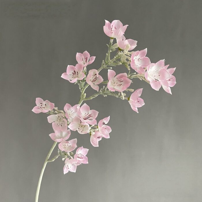 Pink faux flowers bouquet, an artificial flower arrangement perfect for romantic wedding decor.