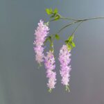 Elegant hanging silk flowers arranged on forks, ideal for wedding decor and sophisticated artificial floral arrangements.