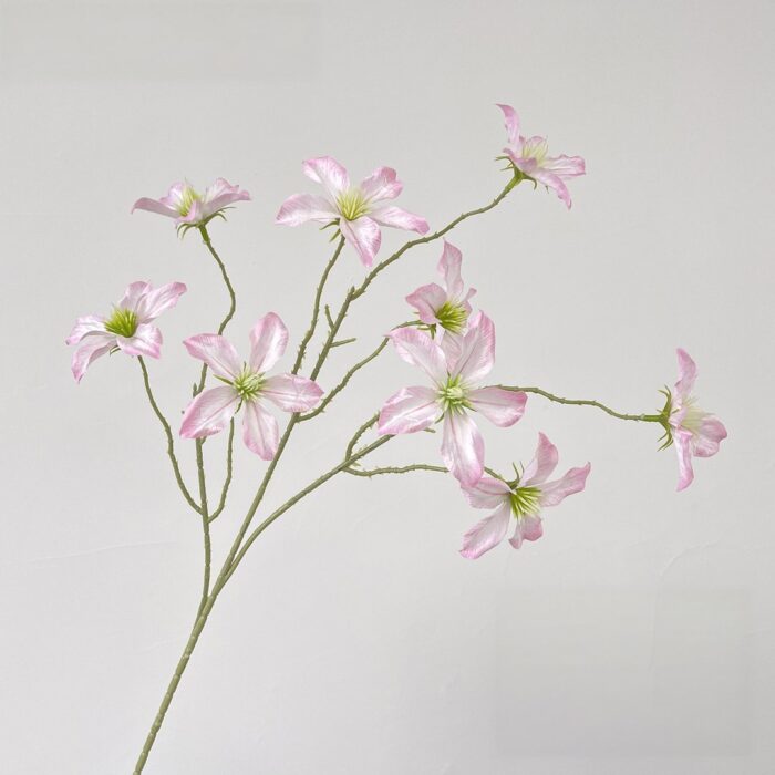 Pink silk clematis blossoms arrangement, ideal faux wedding flowers for durable decor.