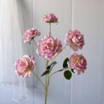 Cluster of pink silk roses, perfect faux wedding flowers for elegant home decor.