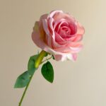 Beautiful pink faux silk rose, ideal for adding elegant decor to wedding arrangements.