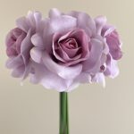 Bouquet of lifelike purple rose artificial flowers suitable for wedding decor.