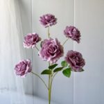 Silk faux rose bouquet for wedding decor, featuring multiple deep pink blooms.