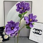 Vase arrangement of artificial flower magnolias, perfect for faux wedding flowers decor.