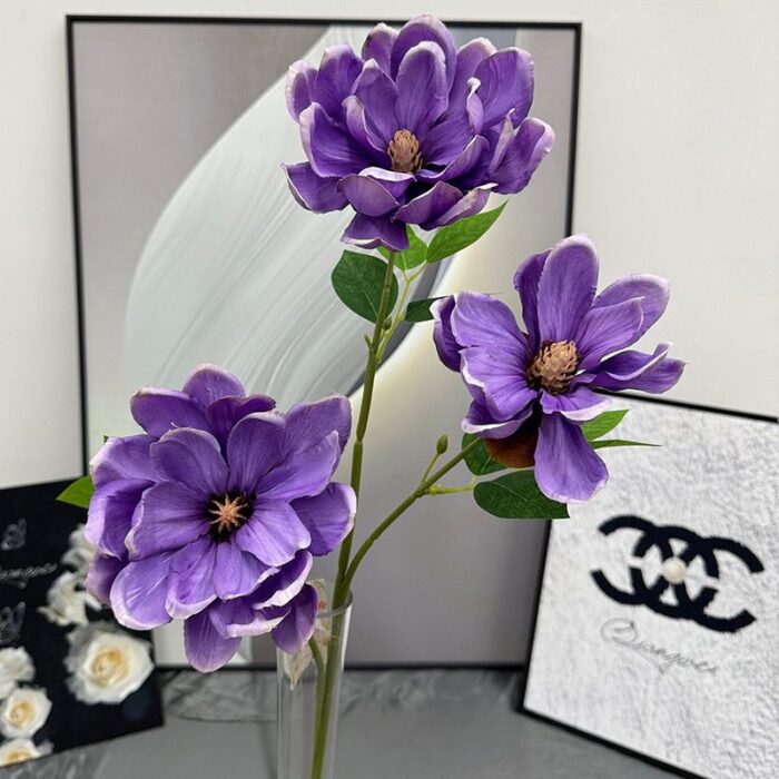 Vase arrangement of artificial flower magnolias, perfect for faux wedding flowers decor.