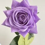 Artificial purple faux rose, ideal for wedding decor and crafting accents.