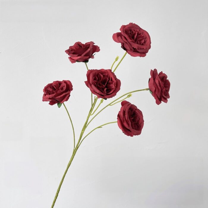Bunch of deep red faux roses perfect for wedding decor and everlasting bouquets.