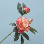 Realistic artificial flower peony blossoms in pink and cream tones for wedding decor.