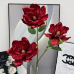 Three vibrant red silk magnolia blooms, perfect faux wedding flowers for decoration.