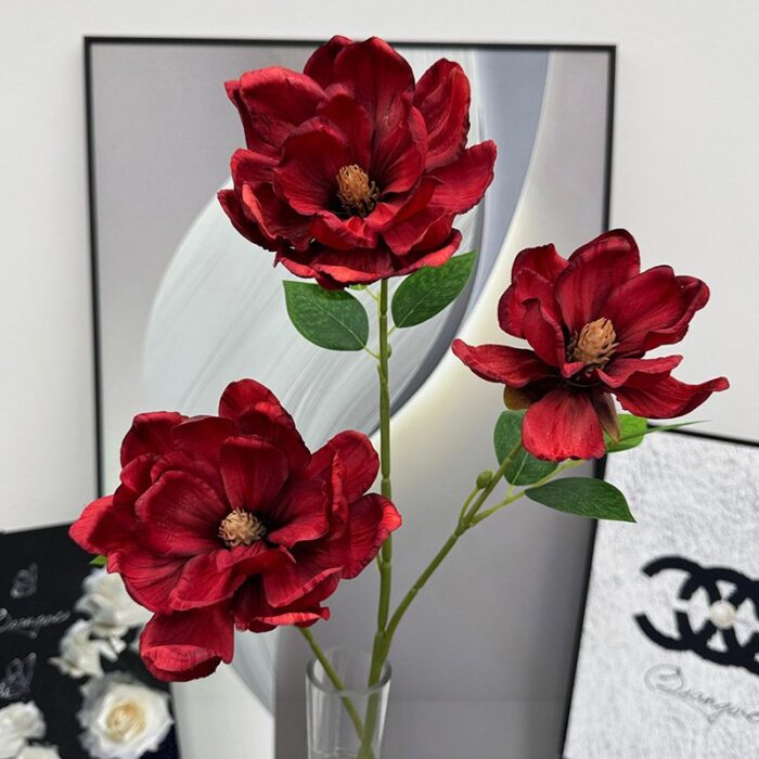 Three vibrant red silk magnolia blooms, perfect faux wedding flowers for decoration.