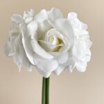 Close-up of white artificial flower rose bouquet, suitable as faux wedding flowers decor.