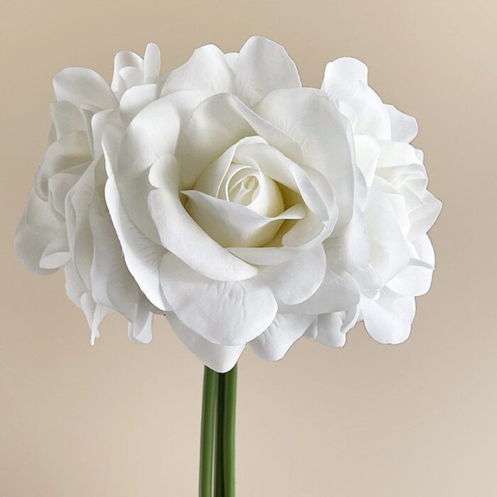 Close-up of white artificial flower rose bouquet, suitable as faux wedding flowers decor.