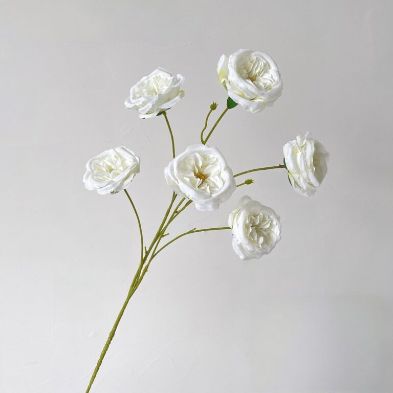 Six white artificial roses designed as faux wedding flowers for everlasting decor.