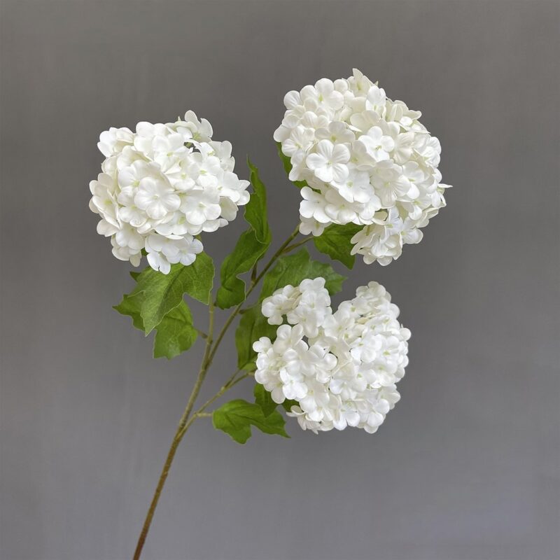 Three heads of white artificial flowers, perfect for faux wedding flowers decor.