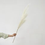 Fluffy artificial plume perfect for boho wedding decor, suitable as faux wedding flowers.