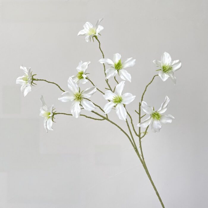 Artificial silk clematis flowers perfect for wedding decor and boutonnieres.