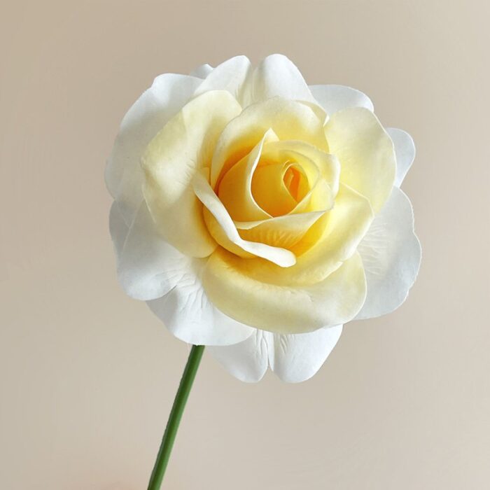 Creamy yellow faux rose bloom, ideal for elegant wedding decor arrangements.