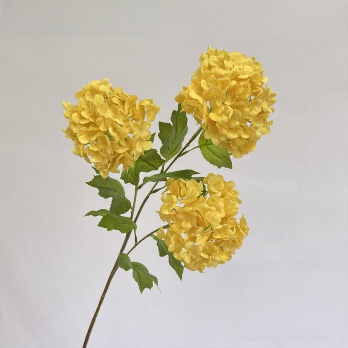 Three heads of realistic yellow artificial flower hydrangeas, perfect for faux wedding floral arrangements.